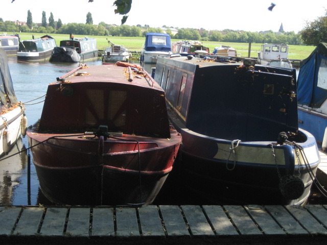 Skinny boats docked